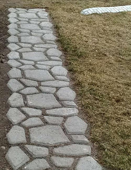 concrete paver walkway with garden edging curb